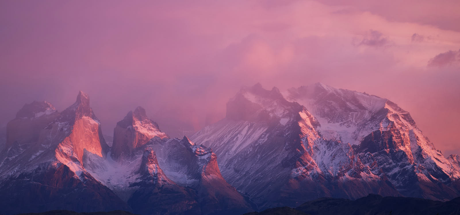 Alpine clouds move quickly in the first light of dawn, Torres del Paine