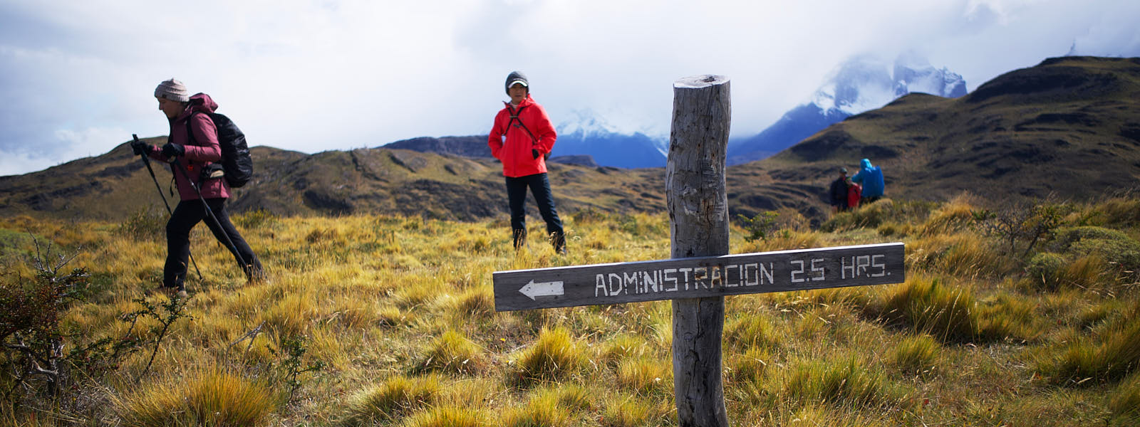 Can our photography tell more about the journey and not just the destination? Hikers pass by a sign on the trail